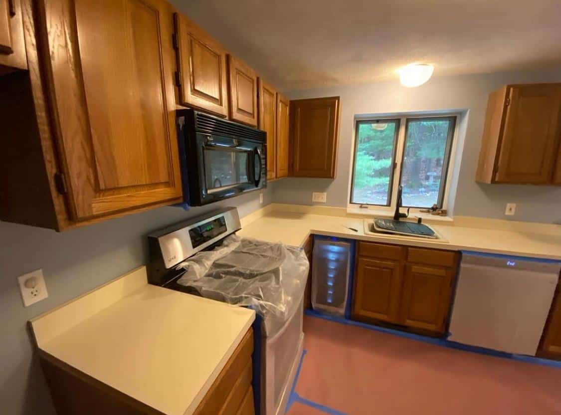 Kitchen before: dated oak cabinets