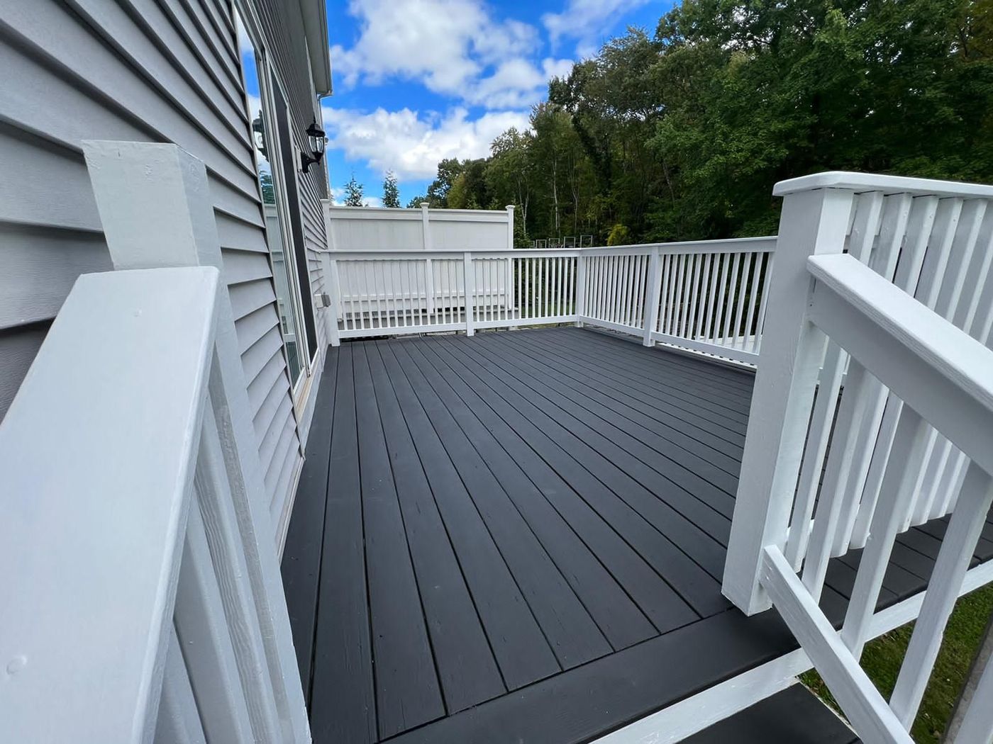 Deck stained gray with white railings