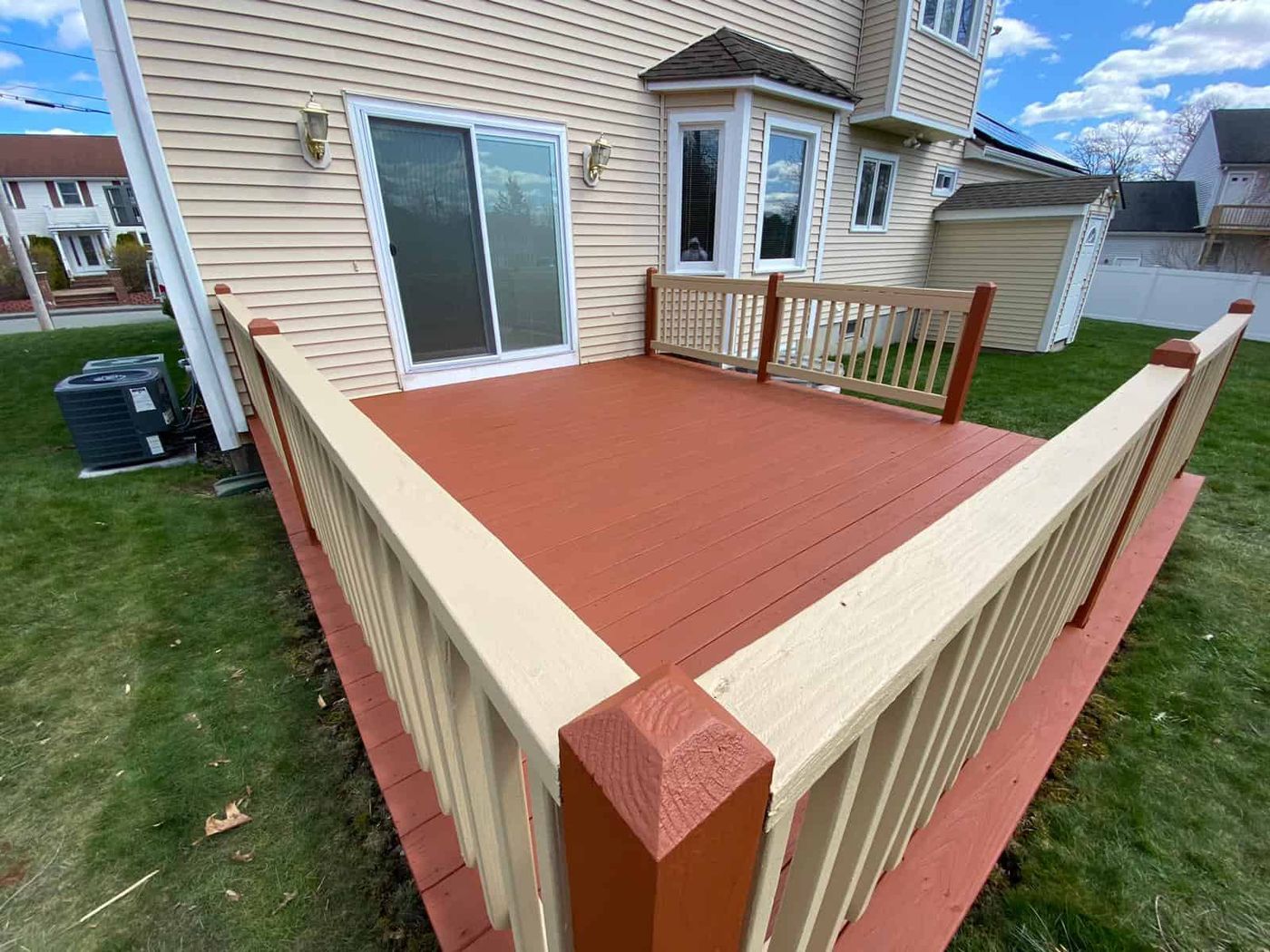 Deck stained red with tan railings